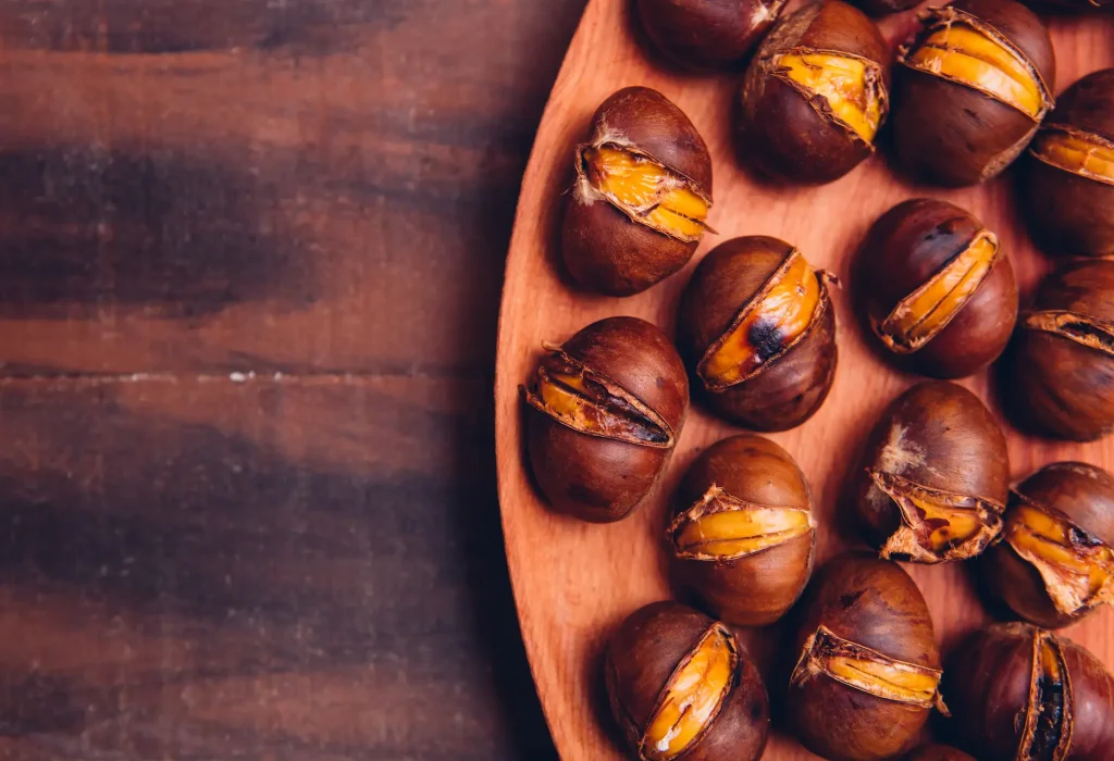 chestnuts-wooden-plate-dark-wooden-table