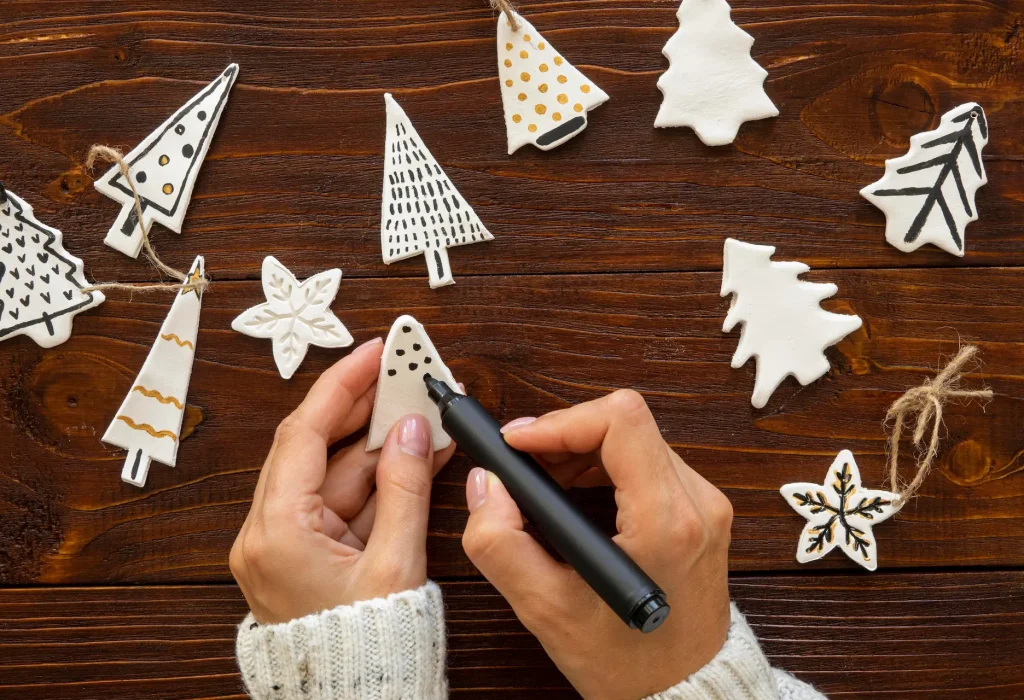 flay-lay-hands-drawing-christmas-tree-decorations