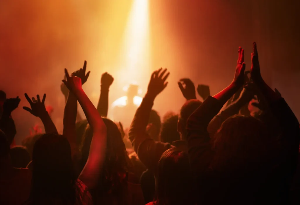 hands-people-crowd-dancing-concert-music-festival-neon-lights-energy-live-event-dance-applause-group-excited-fans-silhouette-rock-band-performance-with-lighting
