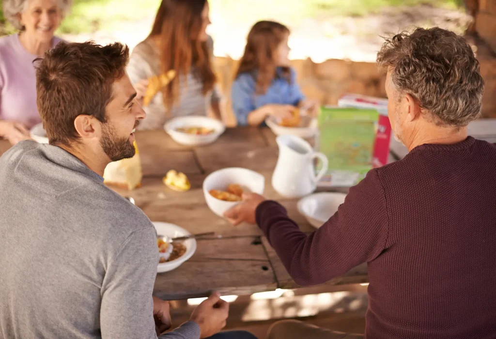 outdoor-women-men-with-family-picnic-nature-backyard-house-smile-joy-group-people-child-eating-breakfast-table-wood-summer-happiness-love-together-home